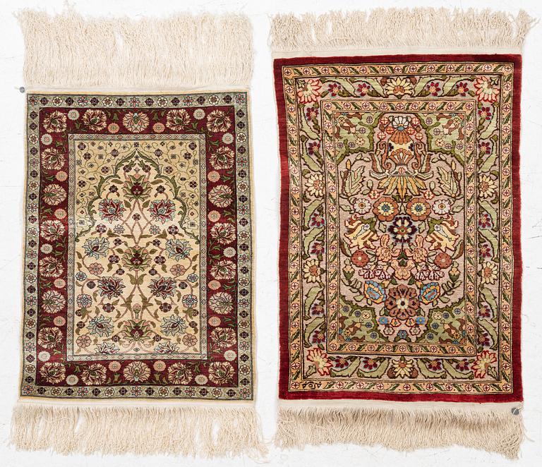 Rugs, two smaller Hereke, silk. 64x44 and 46x43 cm.