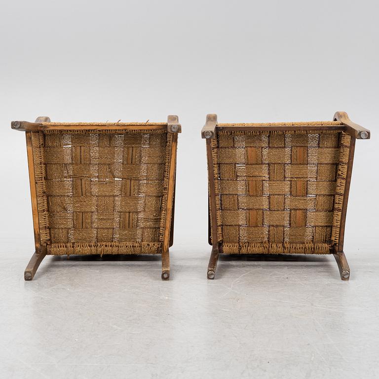 A pair of stained beech armchairs, first half of the 20th Century.