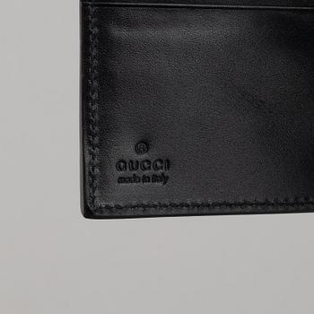 Gucci, väska och plånbok.