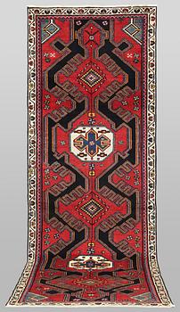 A semi-antique runner carpet, 295 x 100 cm.