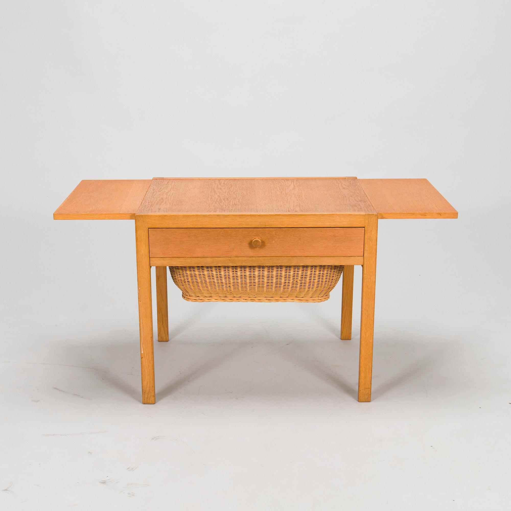 A mid-20th-century sewing table.