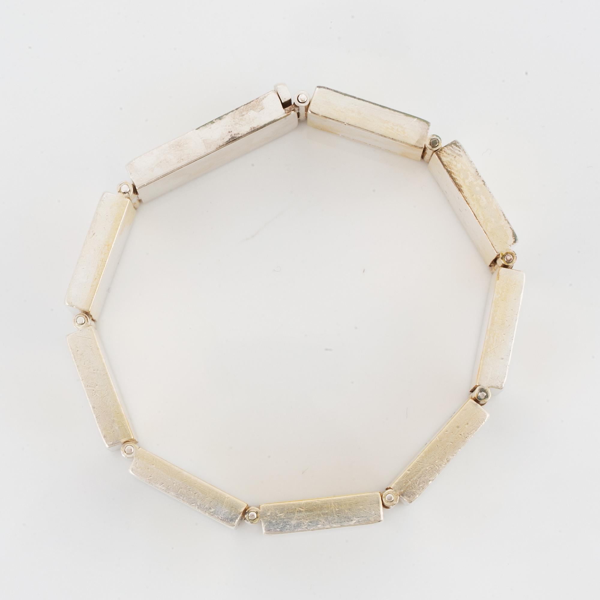 A Michael Hamma bracelet in silver and 18K gold.