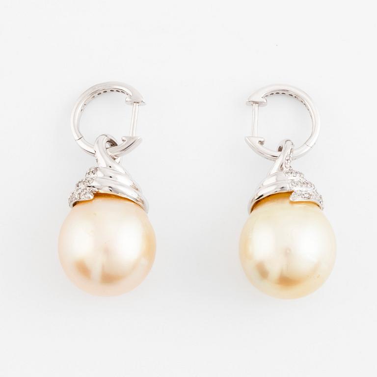 A pair of 18K white gold cultured South Sea pearl earrings.