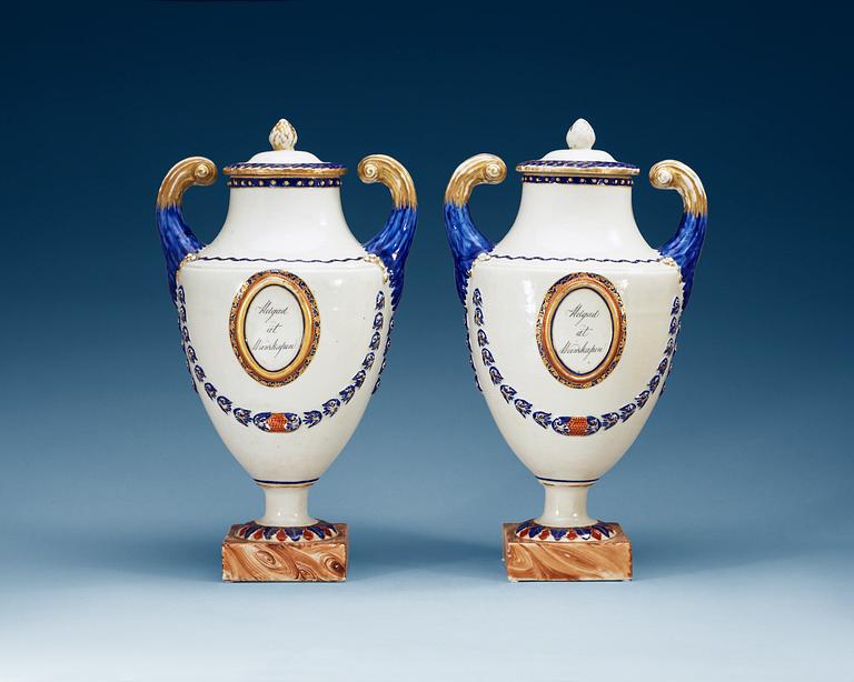 A pair of famille rose vases with covers, Qing dynasty, Qianlong (1736-95).