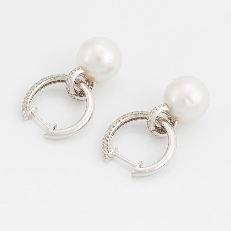 Pearl and brilliant cut diamond earrings.