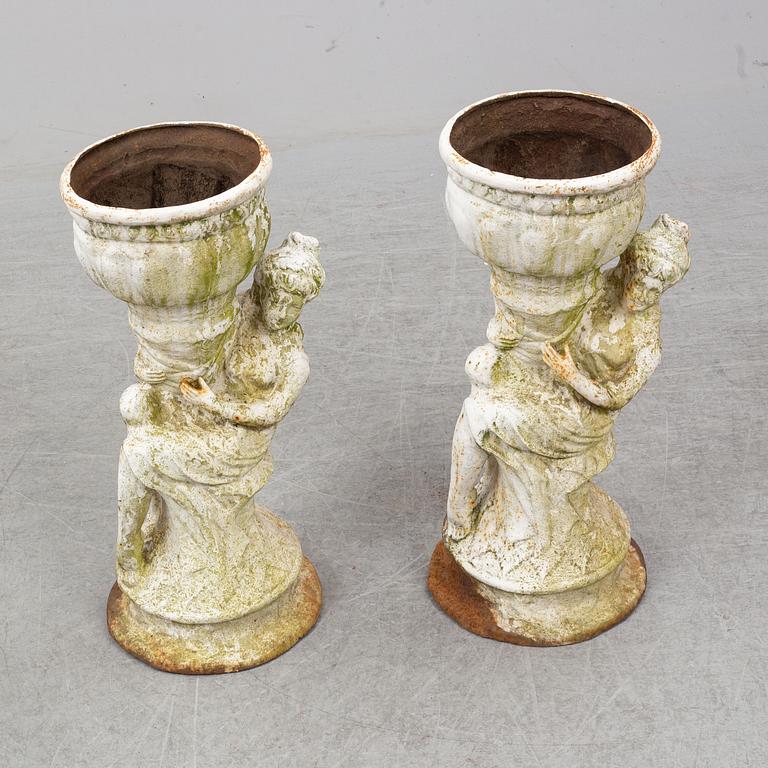 An end of the 20th Century pair of cast  iron flower pots.