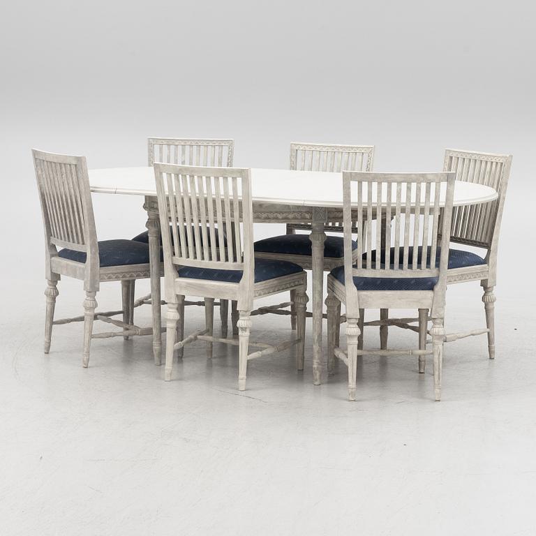 A Gustavian style dining table and six chairs, late 20th Century.