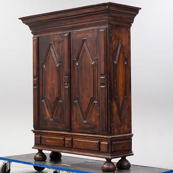 A first half of the 18th Century Baroque stained pine cabinet.