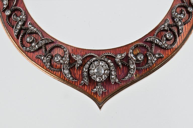 AN ENAMELLED BROOCH WITH DIAMONDS.
