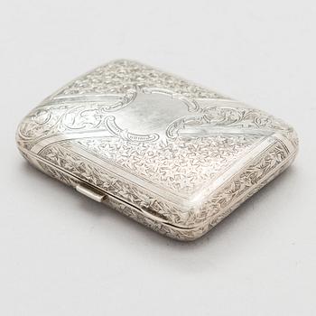 An English sterling silver cigarette case, maker's mark William M. Hayes, of Birmingham, 1896.