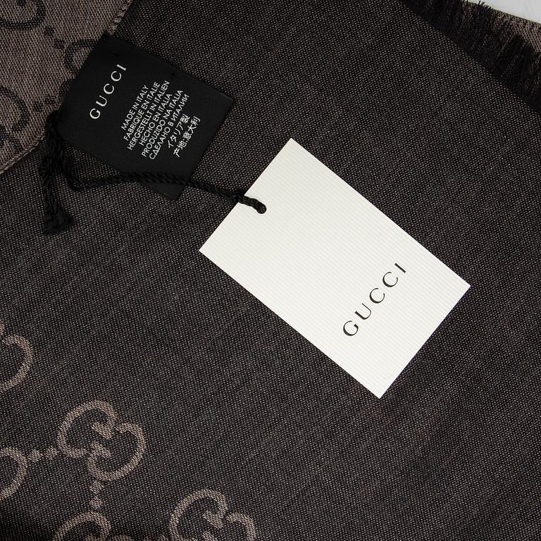 Gucci, a wool and silk mix 'GG' jaquard shawl.