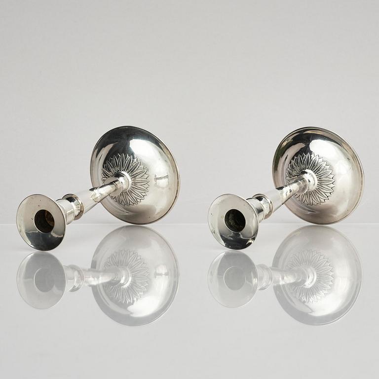 Two pair of early 19th century silver candlesticks, marks of Anders Lundqvist, Stockholm, Sweden 1819 and 1821.
