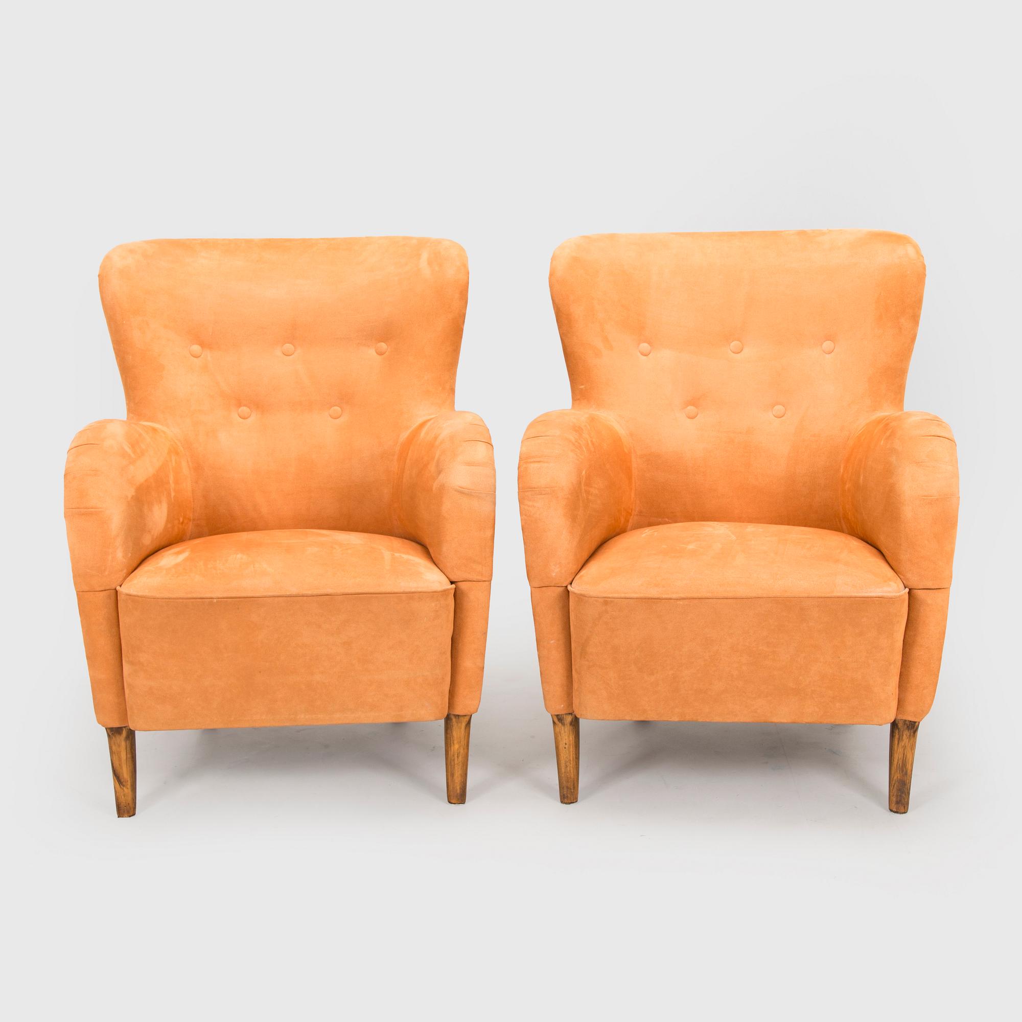 A pair of mid-20th century armchairs.