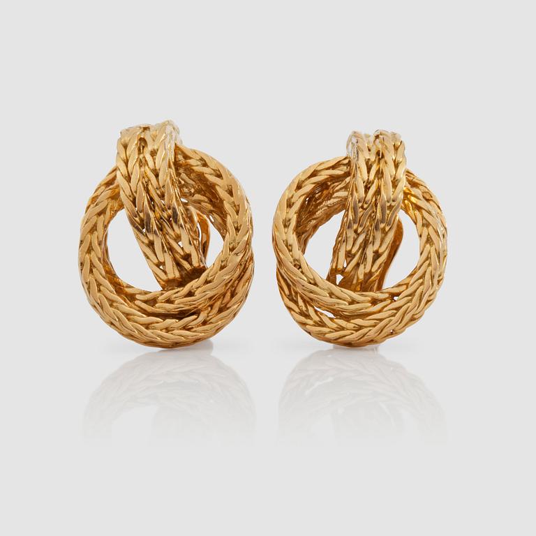A pair of Hermés earrings.
