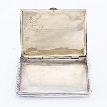 Cigarette case of silver with a cabochon-cut blue stone, first half of the 20th century.