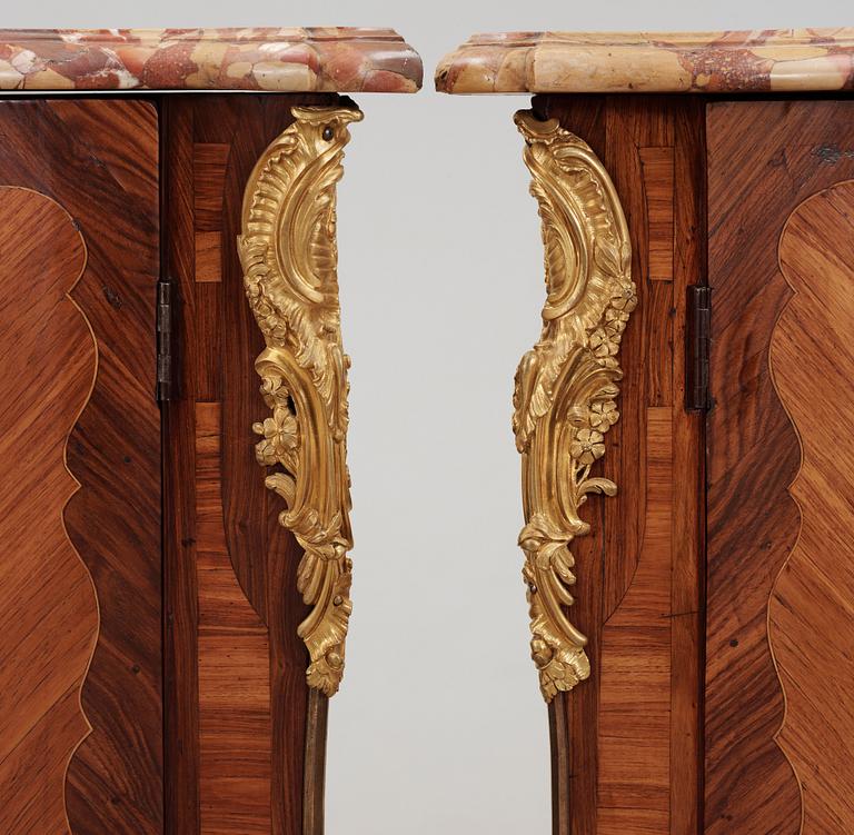 A pair of Louis XV 18th century corner cabinets by F. Reizell.