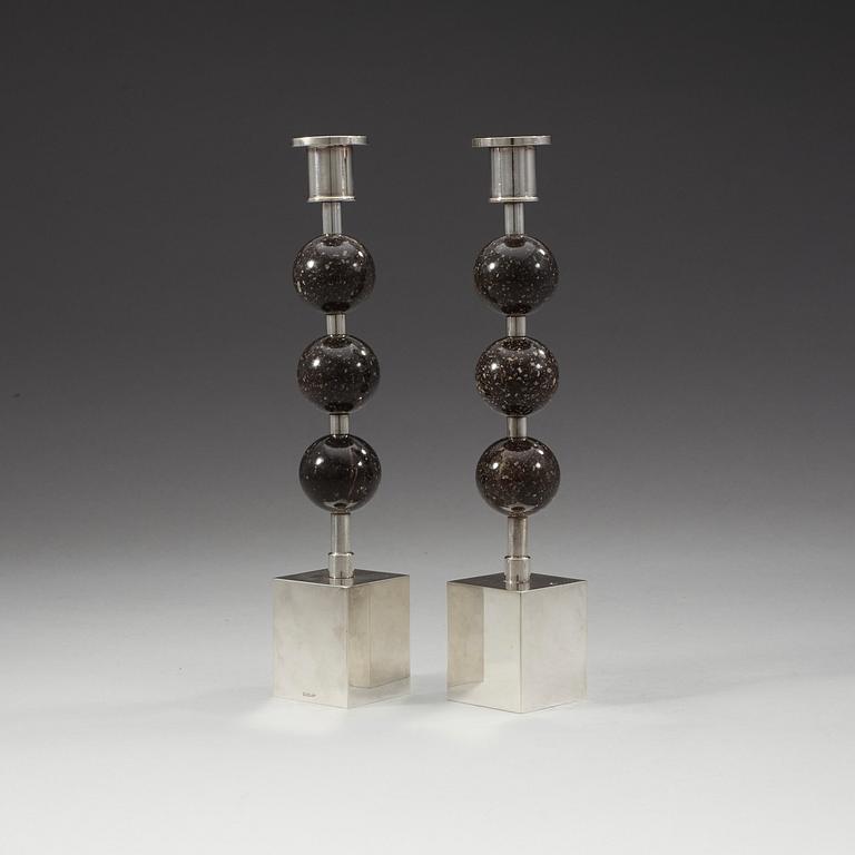 Sigurd Persson, a pair of silver plated and porphyry candlesticks, Sweden.