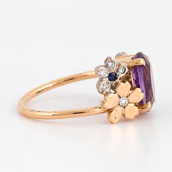 Oval faceted amethyst, brilliant-cut diamond and sapphire flower ring.