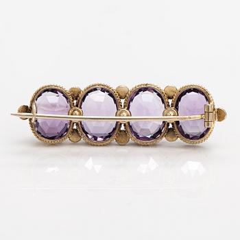 A necklace, bracelet and two brooches in gilded silver and with amethysts and pearls.