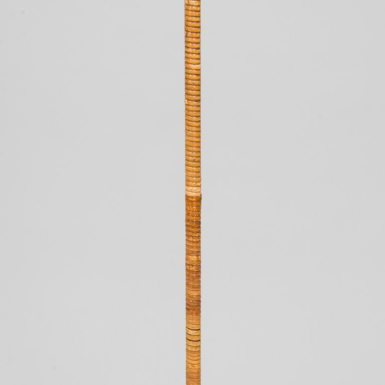 Paavo Tynell, a mid-20th century K10-10 floor lamp for Taito.