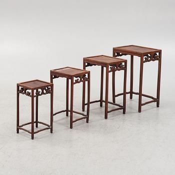 A three-piece hardwood nesting table, China, late Qing dynasty.