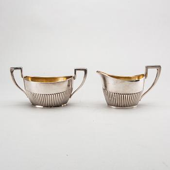 A three piece silver coffee service mark of CG Hallberg Stockholm 1916, weight 896 gram.