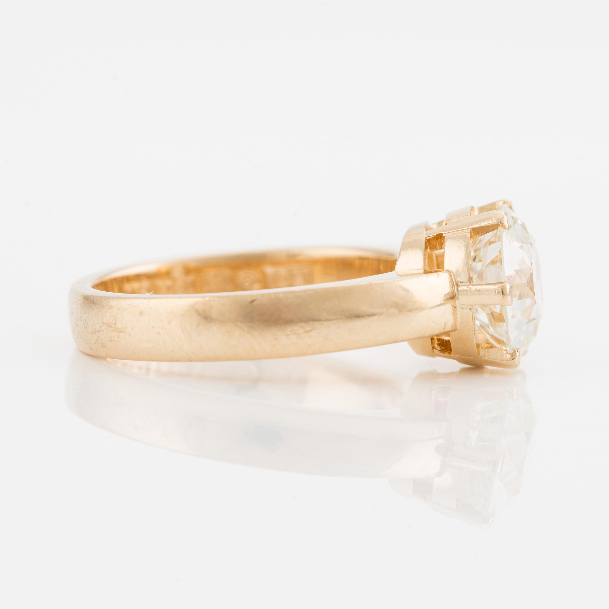Ring with old-cut diamond.