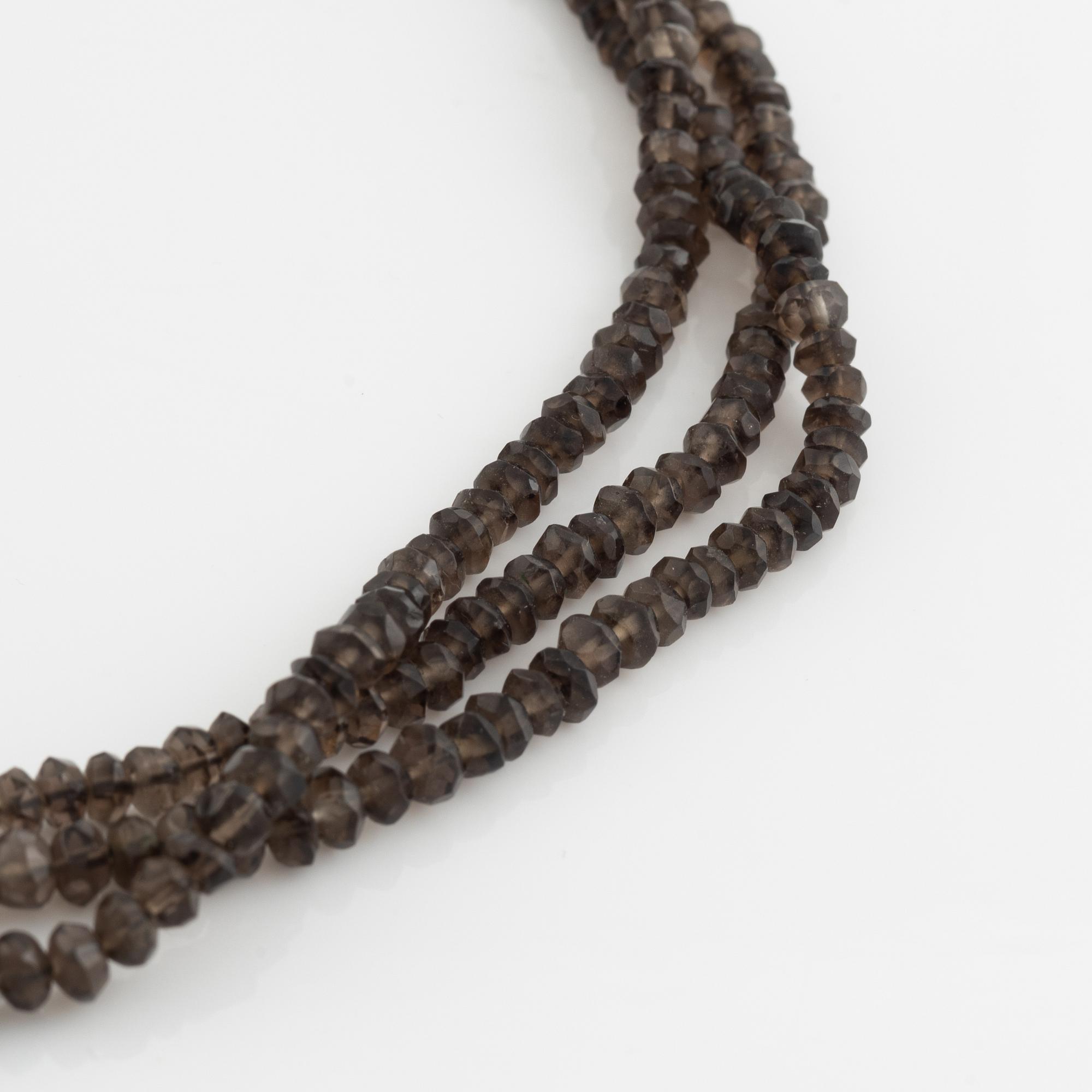Ole Lynggaard,  smoky quartz necklace, clasp gold heart.