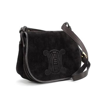 CÈLINE, a black suede handbag.