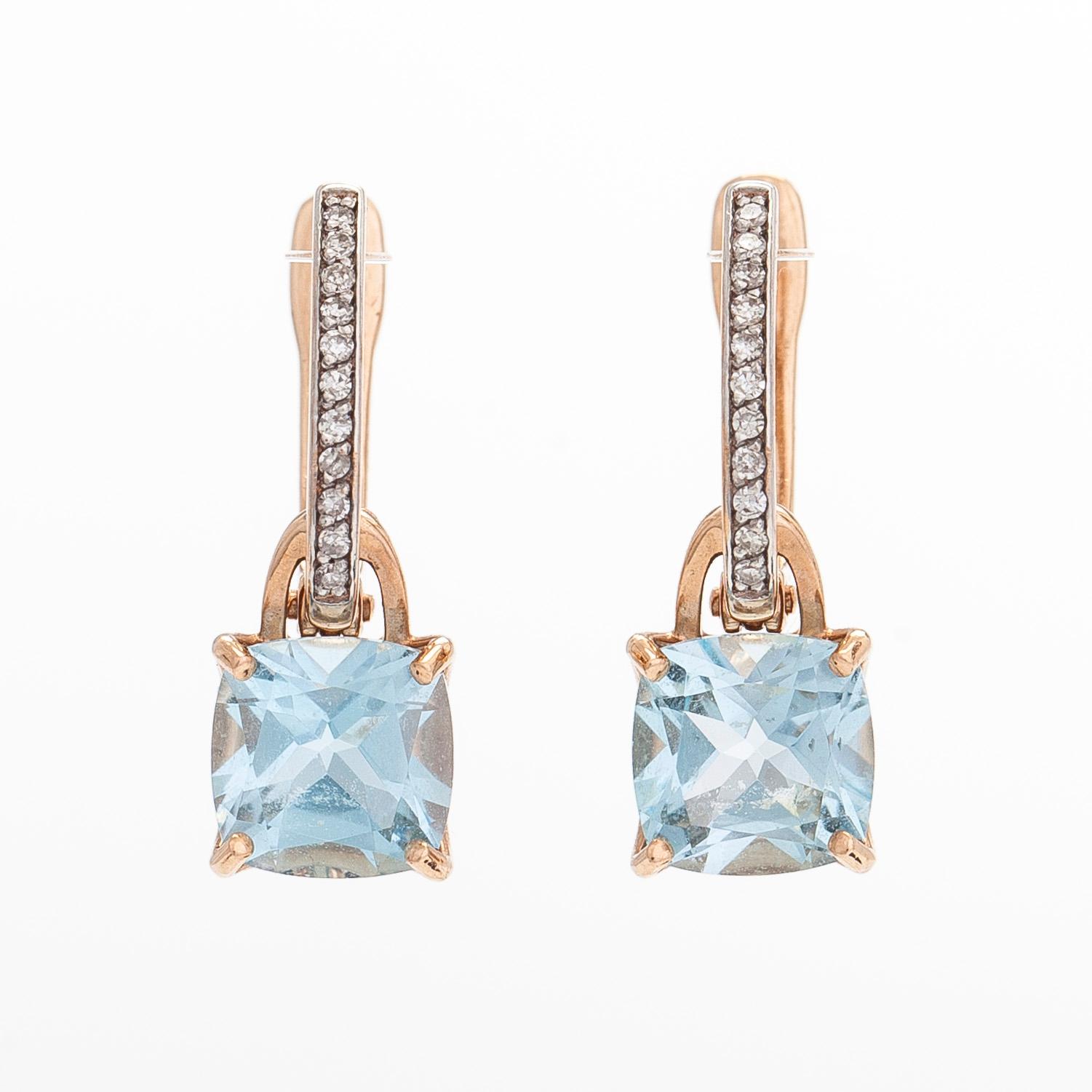 A pair of 14K rosegold earrings, with diamonds and topazes. Soviet Union.