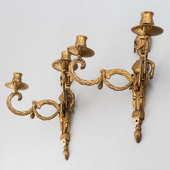A 20th Century pair of Louis XVI style wall sconces, for two candles.
