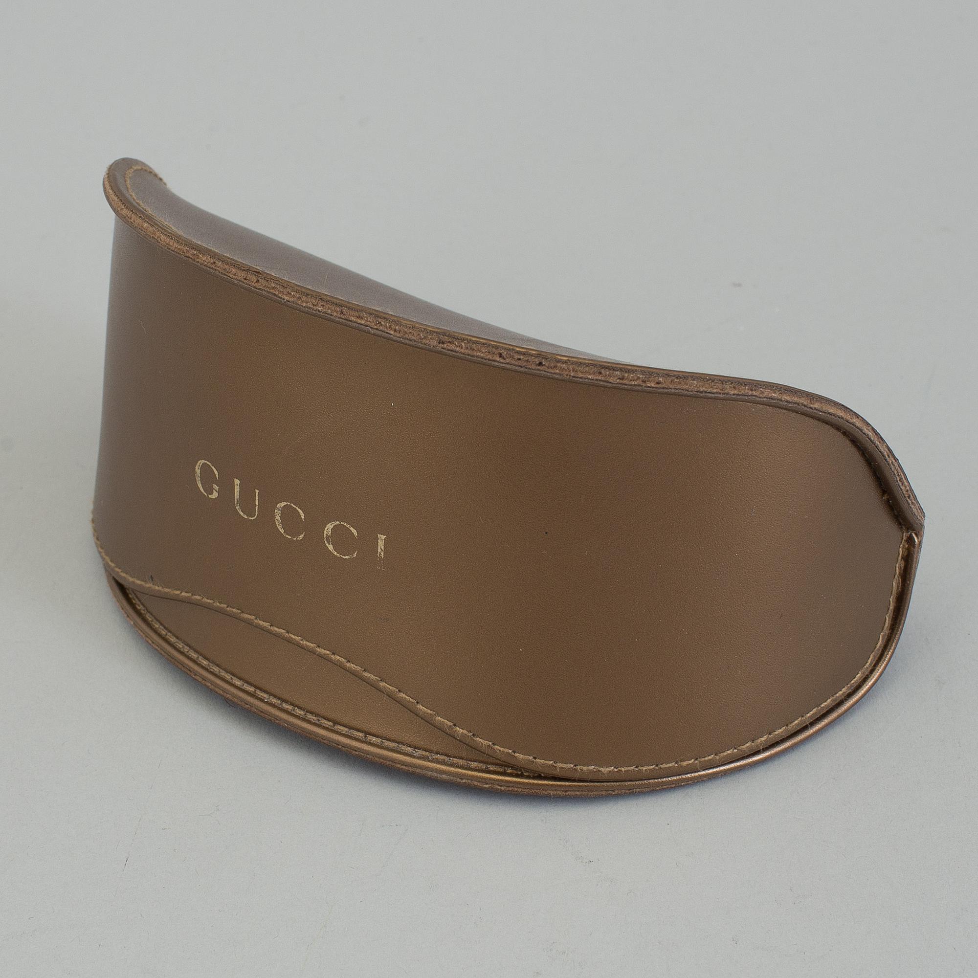 A pair of Gucci GG2970/S sunglasses with case.