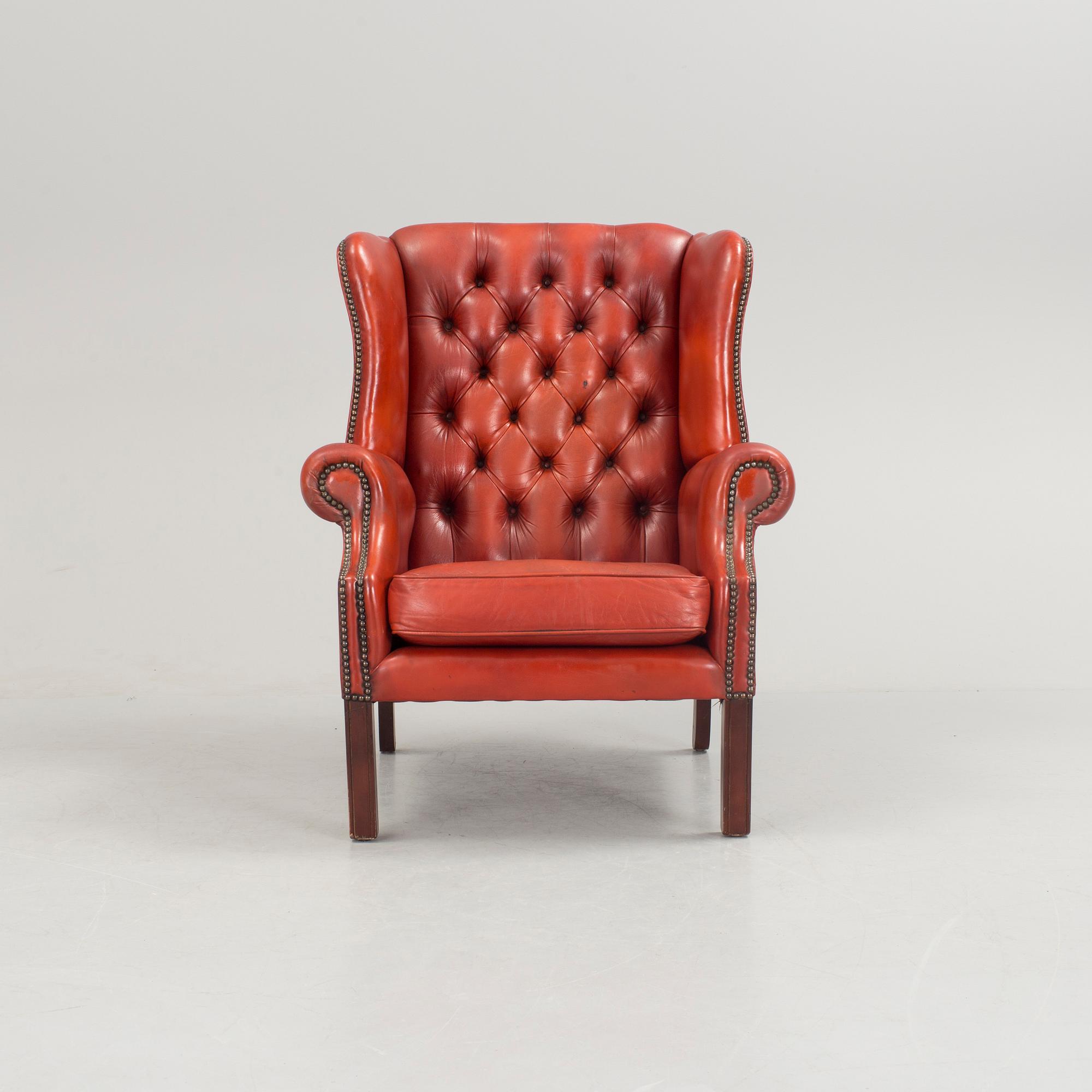 a 20h Century red lether armchair.