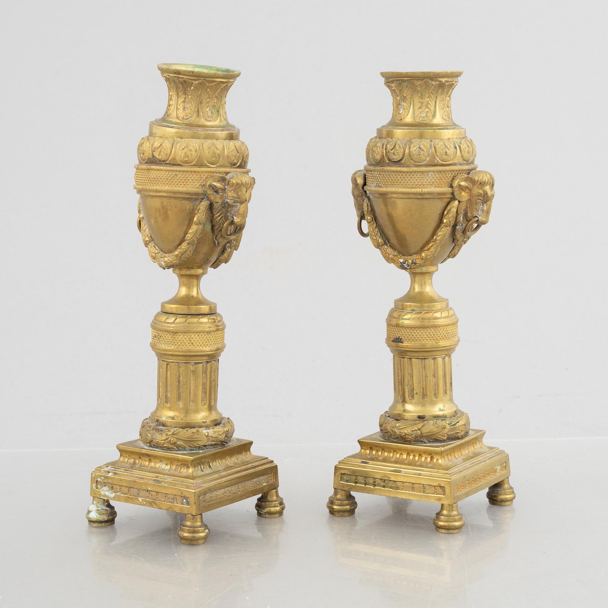 A pair of Louis XVI-style candlesticks, late 19th century.