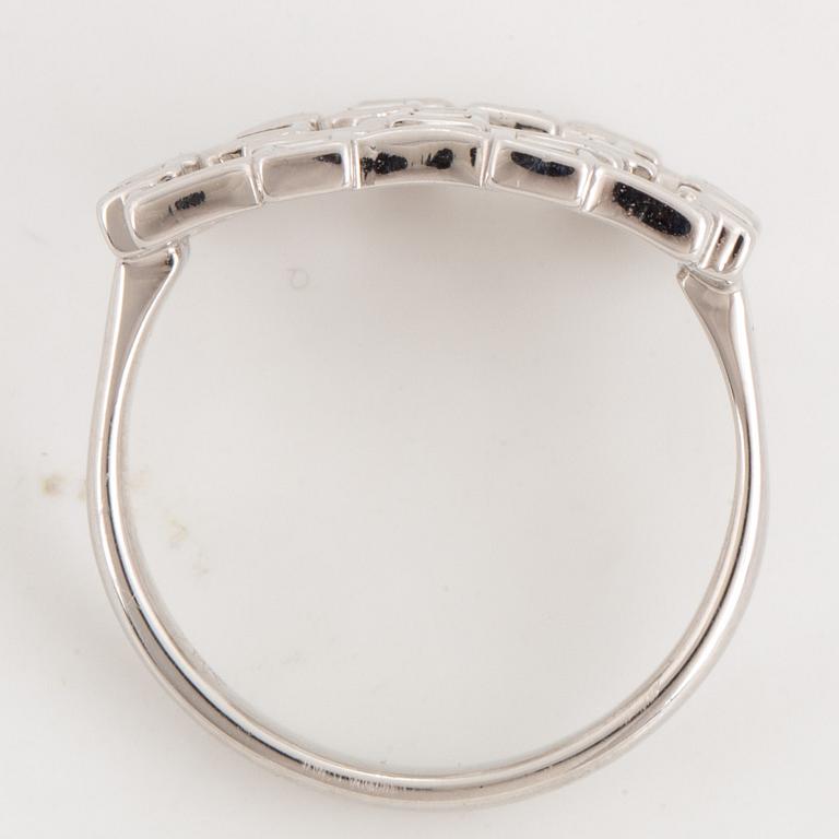 Step-cut diamond ring.