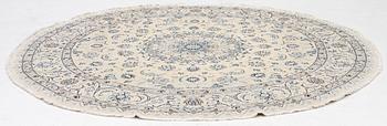 A Nain rug, diameter a. 247 cm.