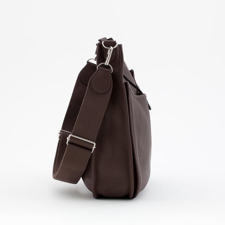 HERMÈS, a taurillon clemence chocolat shoulder bag, "Evelyn III / GM".