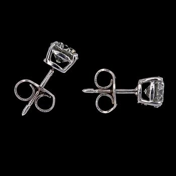 A pair of brilliant cut diamond ear studs, each 0.70 cts.