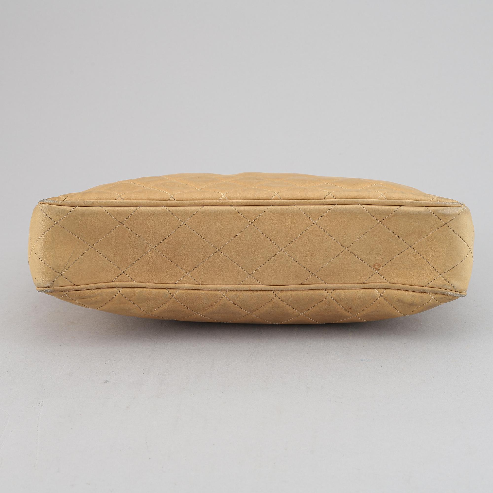 Chanel, a beige leather handbag, 1986-1988.