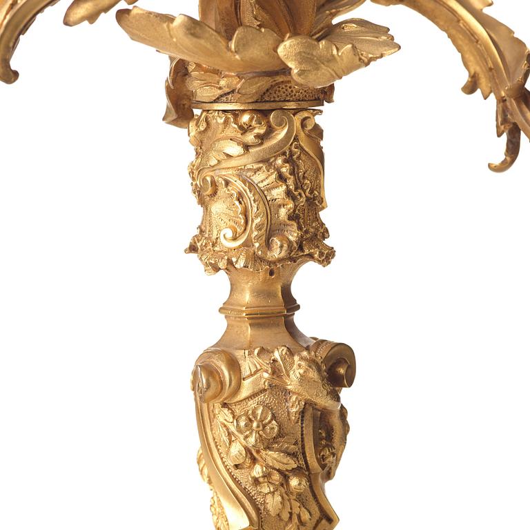 A pair of Neo-Rococo 1840's two-light gilt bronze candelabra.