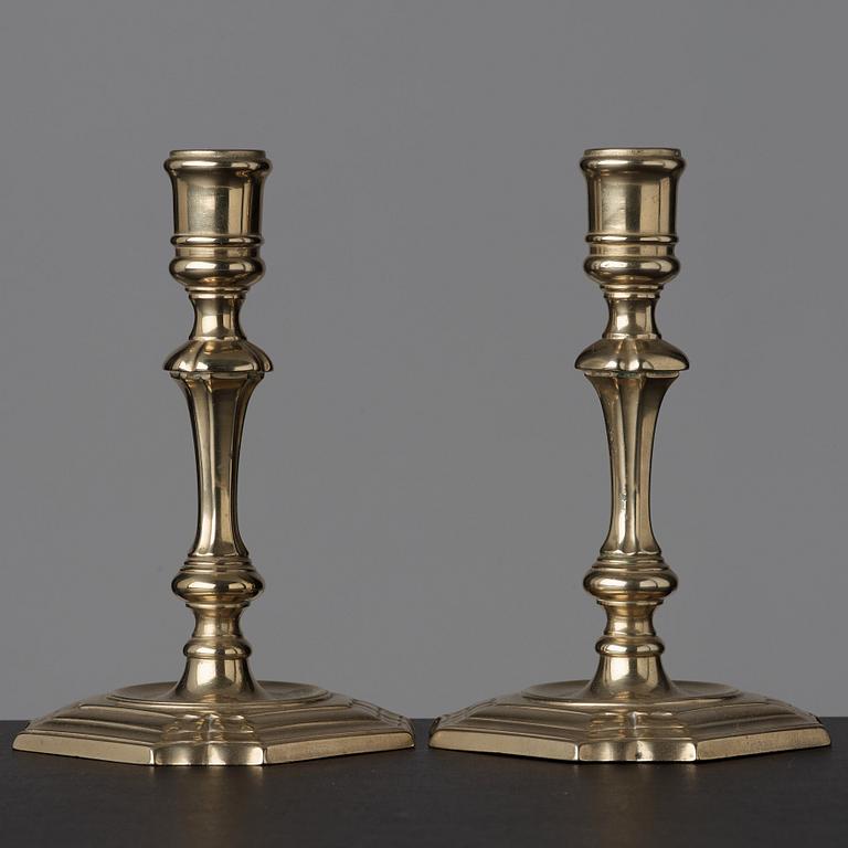 A pair of late baroque 18th century paktong candlesticks.