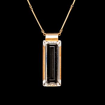 An 18K gold necklace set with a step cut rock crystal quartz by Ateljé Stigbert 1943.