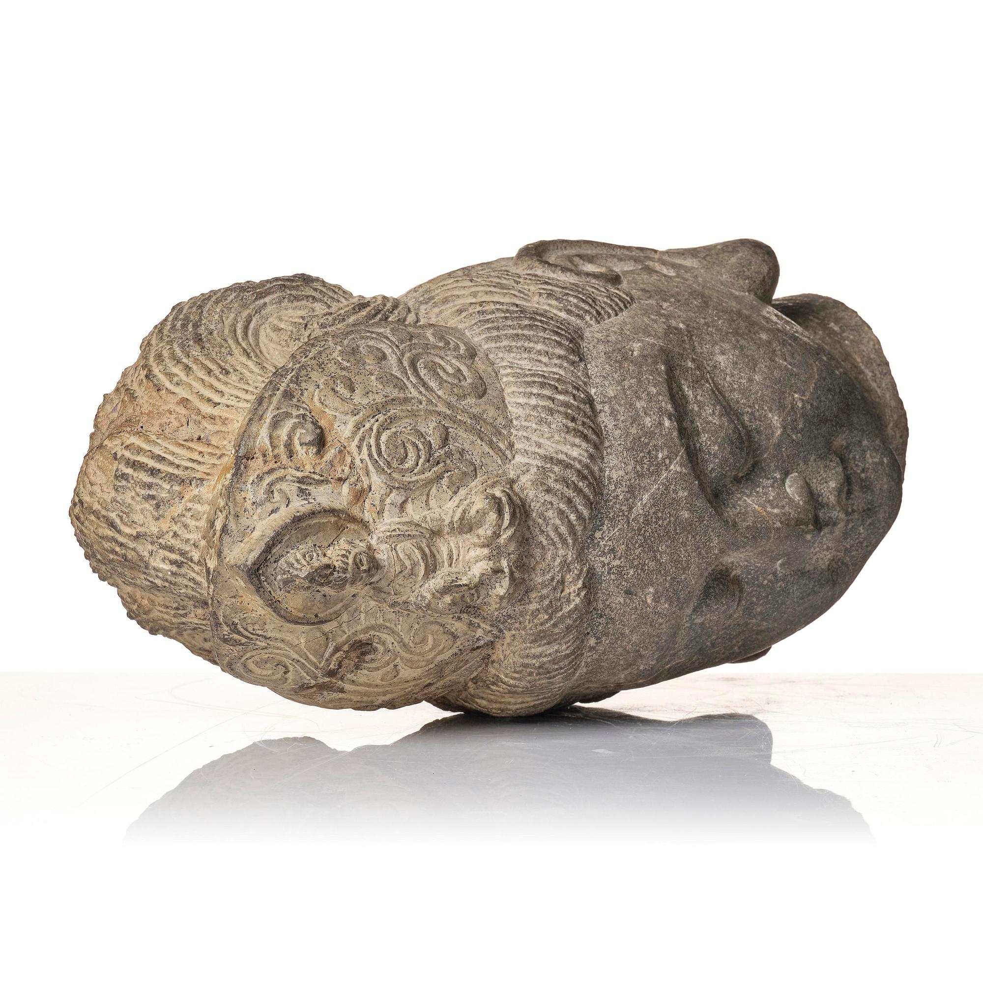 A large well sculptured head of Guanyin, Ming dynasty (1368-1644).