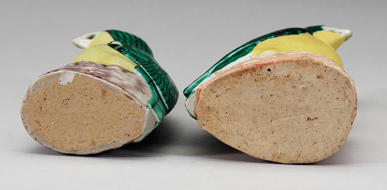 A set of two green and yellow glazed parrots, Qing dynasty, Jiaqing (1796-1820).