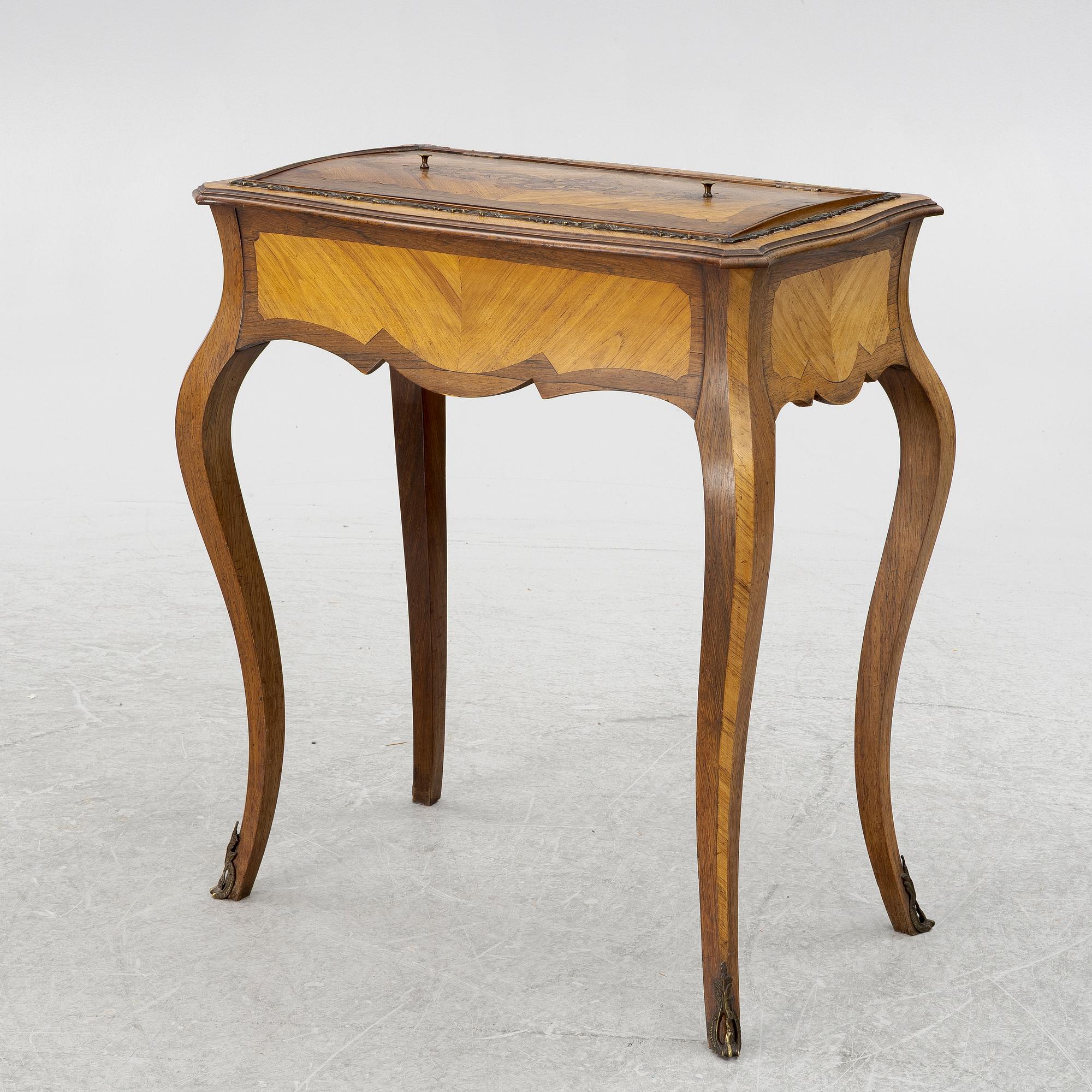 A Louis XV style table, circa 1900.
