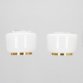Lisa Johansson-Pape, A mid-20th century '71-143' pair of ceiling lamps for Stockmann Orno.