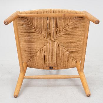 Hans J. Wegner, four model CH-24/ 'Wishbone' chairs, Carl Hansen, Odense, Denmark, second half of the 20th century.