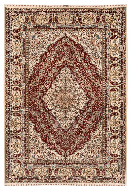 A semi-antique silk Hereke rug, West Anatolia, c. 180 x 121 cm.