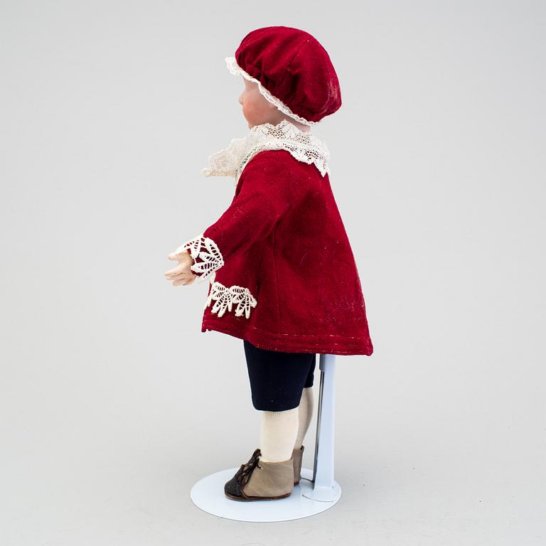 A bisque headed character boy doll, Germany, 1910s.