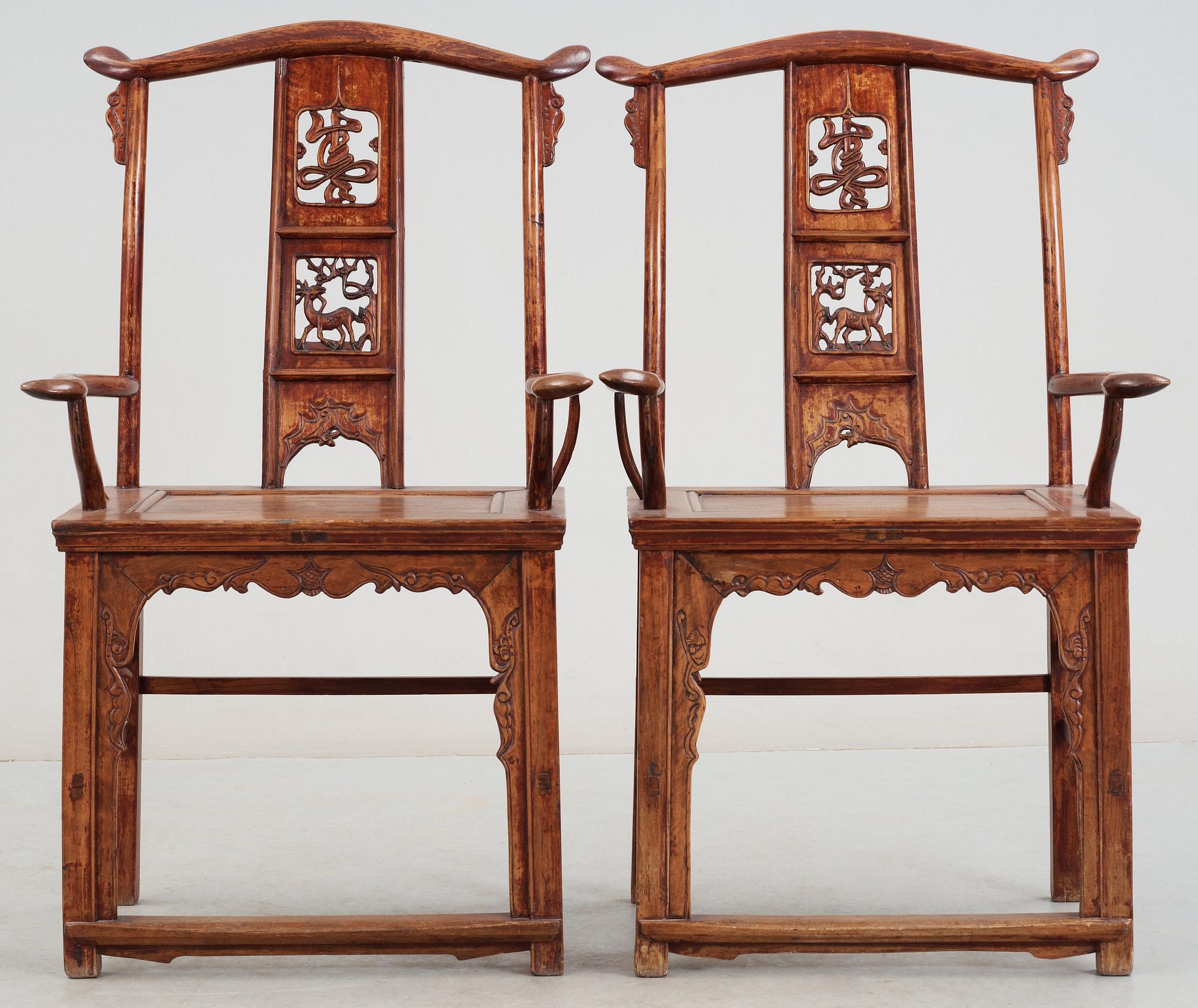 A pair of hardwood armchairs, late Qing dynasty (1644-1912).